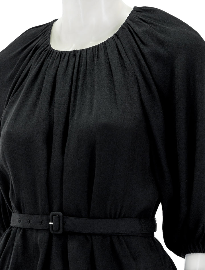 Close-up view of Staud's arlo top in black.