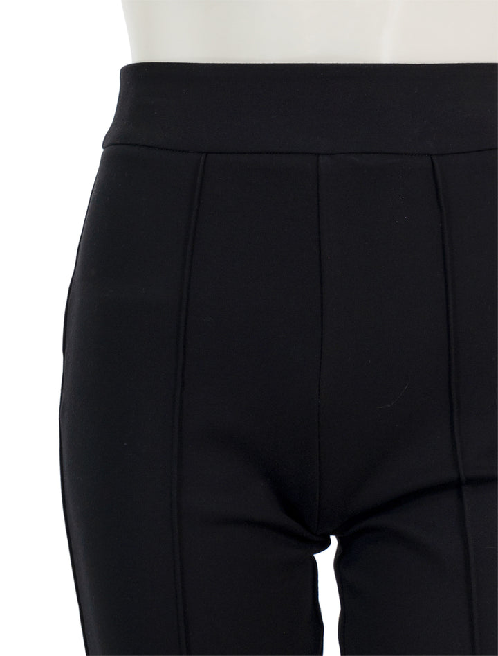 Close-up view of Staud's knack pant in black.