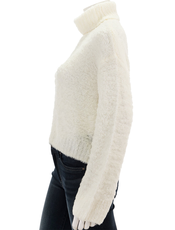 Side view of STAUD's ezio sweater in white.