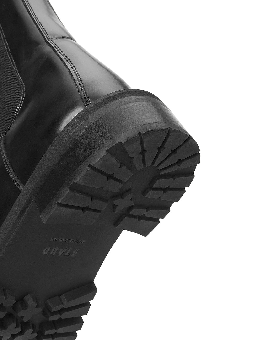 Close-up view of Staud's dutch boot in black.