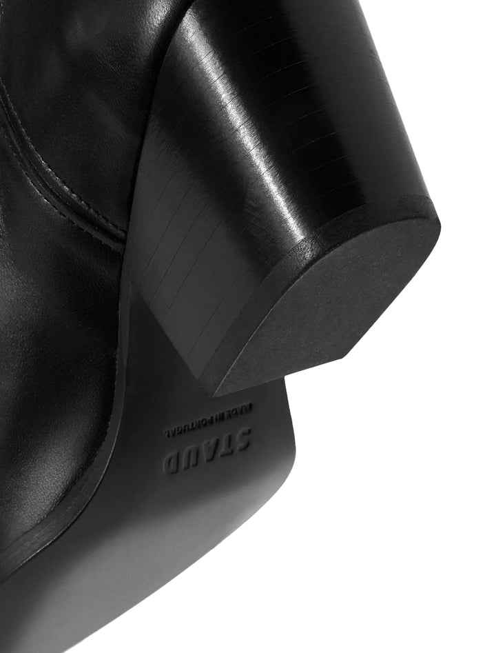 Close-up heel view of STAUD's june boot in black.