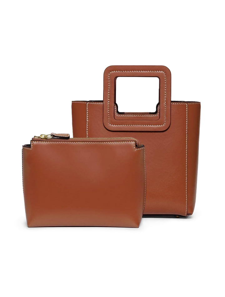 Front view of STAUD's mini shirley leather bag in tan with inside pouch shown.