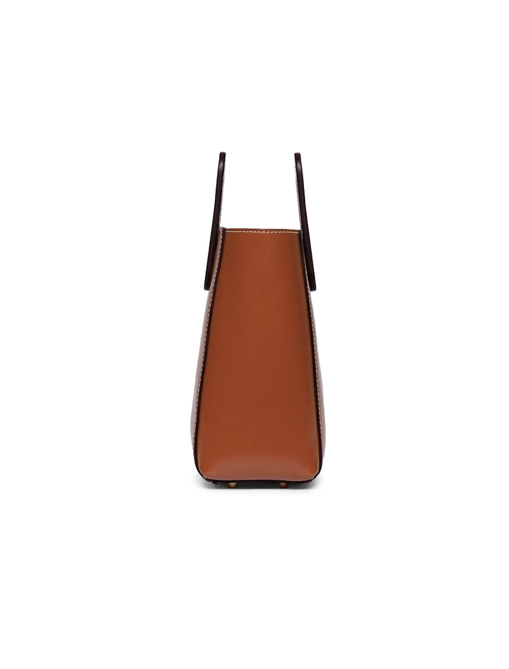 Side view of STAUD's mini shirley leather bag in tan.