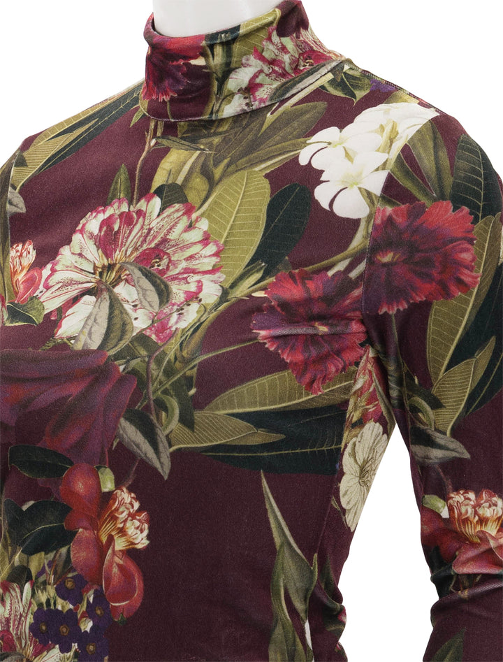 Close-up view of Cara Cara's suzie top in garden flora.
