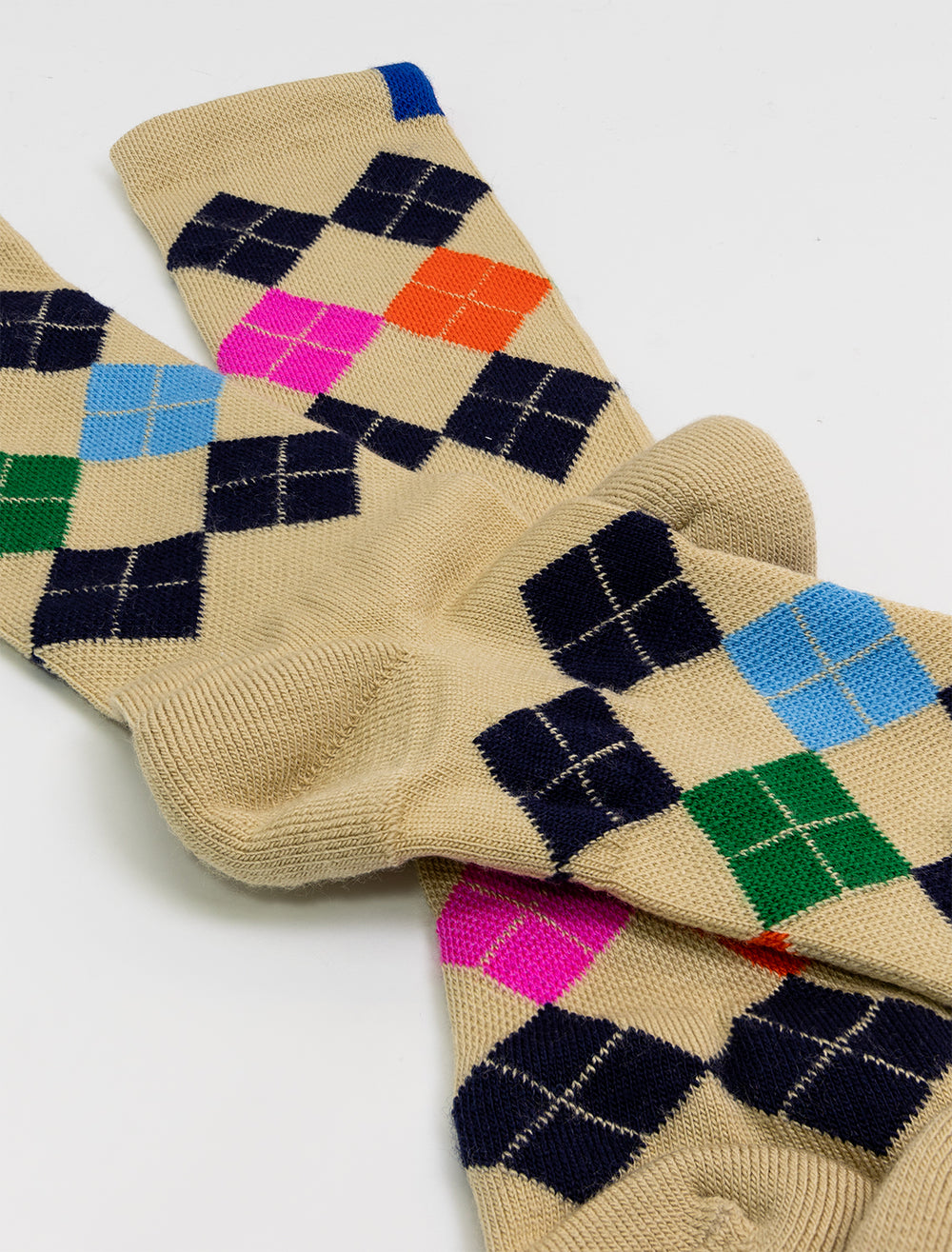 Close-up view of KULE's argyle socks.