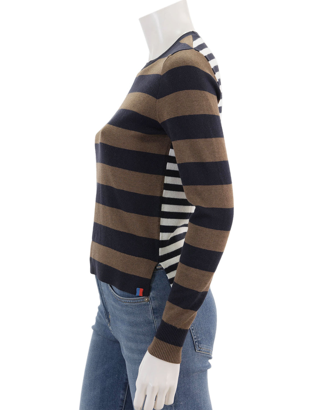 Side view of KULE's gemini sweater in walnut navy and white.