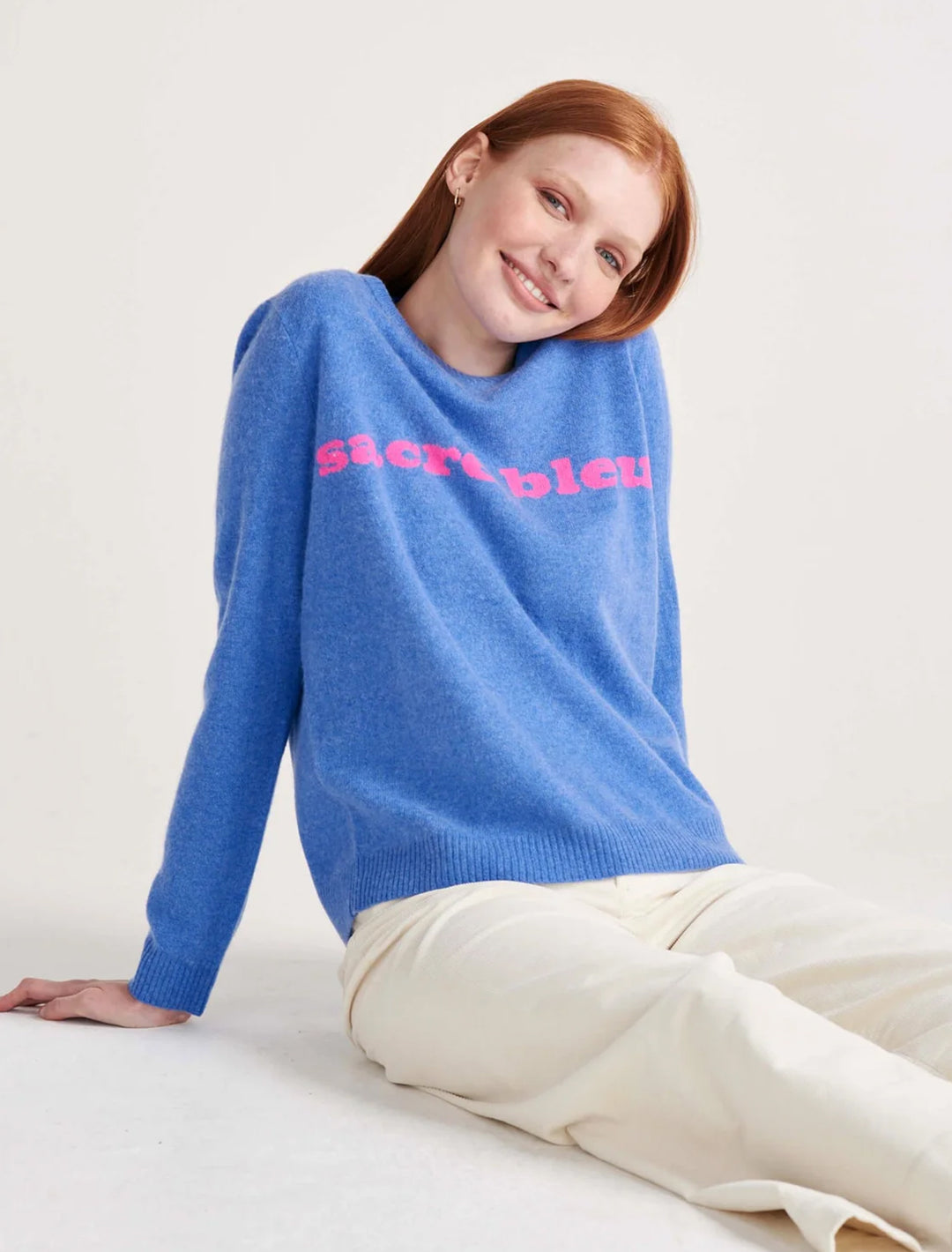 Model wearing Jumper 1234's sacre bleu crew in periwinkle and hot pink.