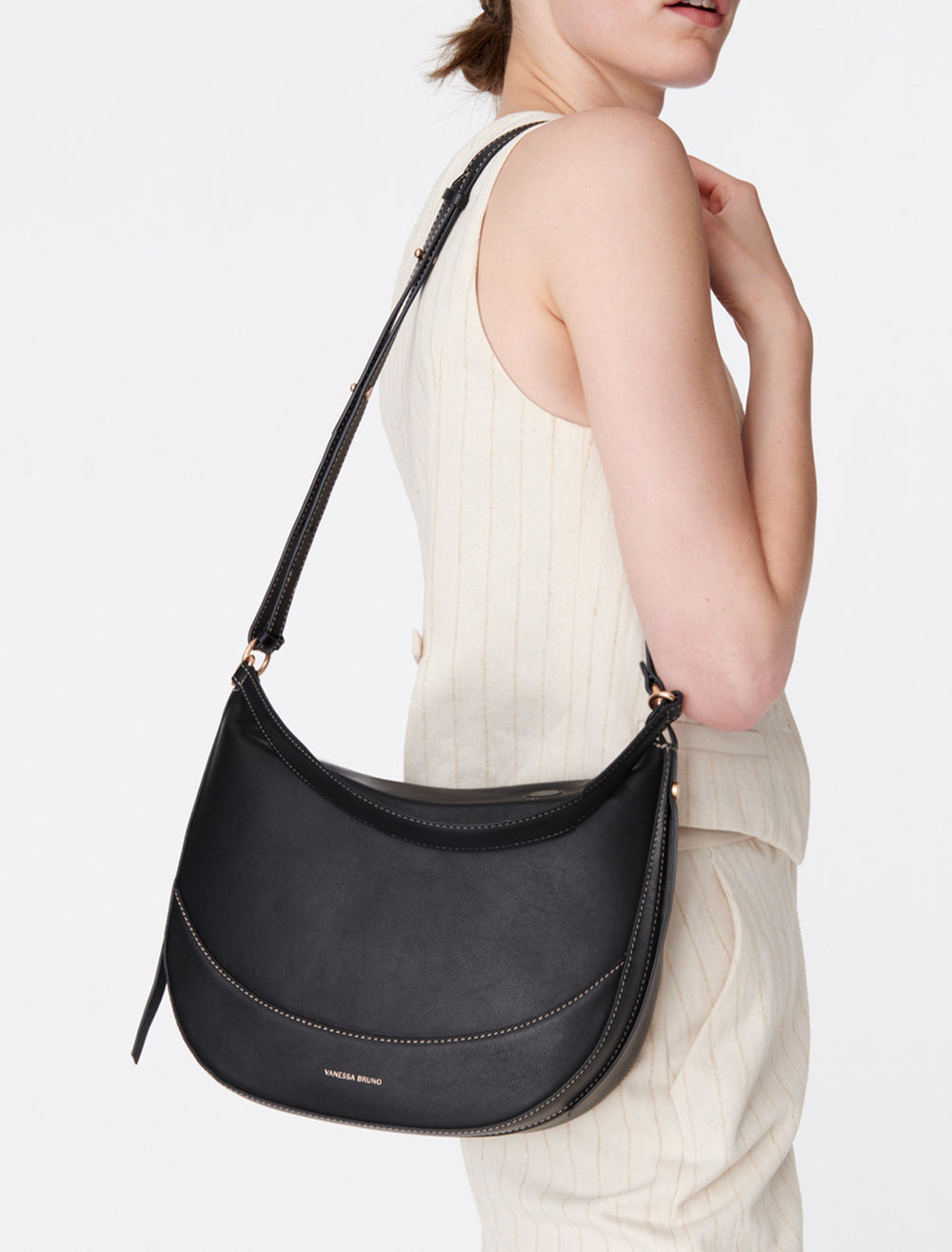 Model holding Vanessa Bruno's daily bag in noir.