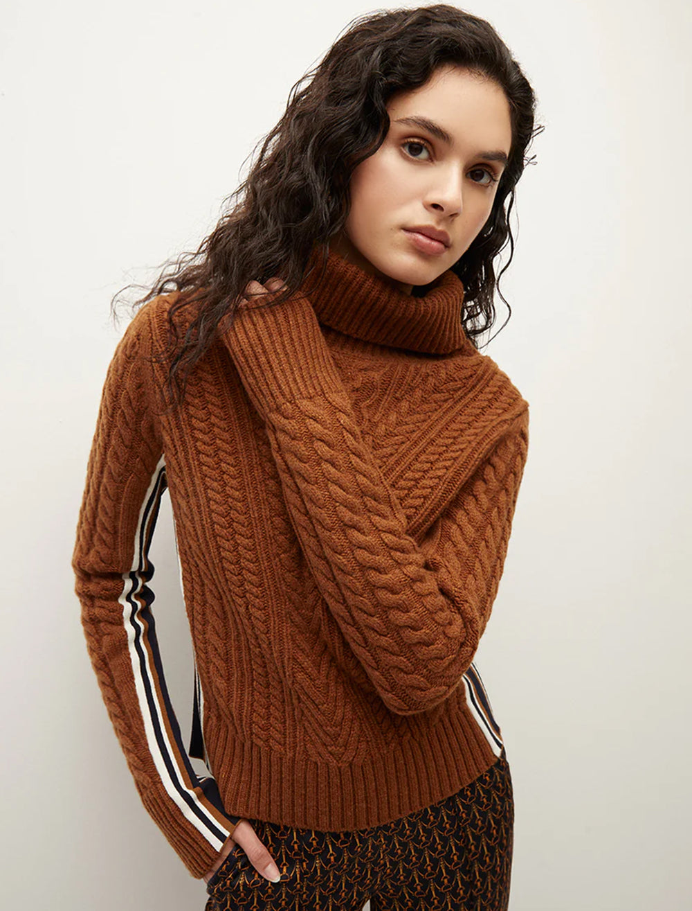 Model wearing Veronica Beard's maril sweater in dark ochre.