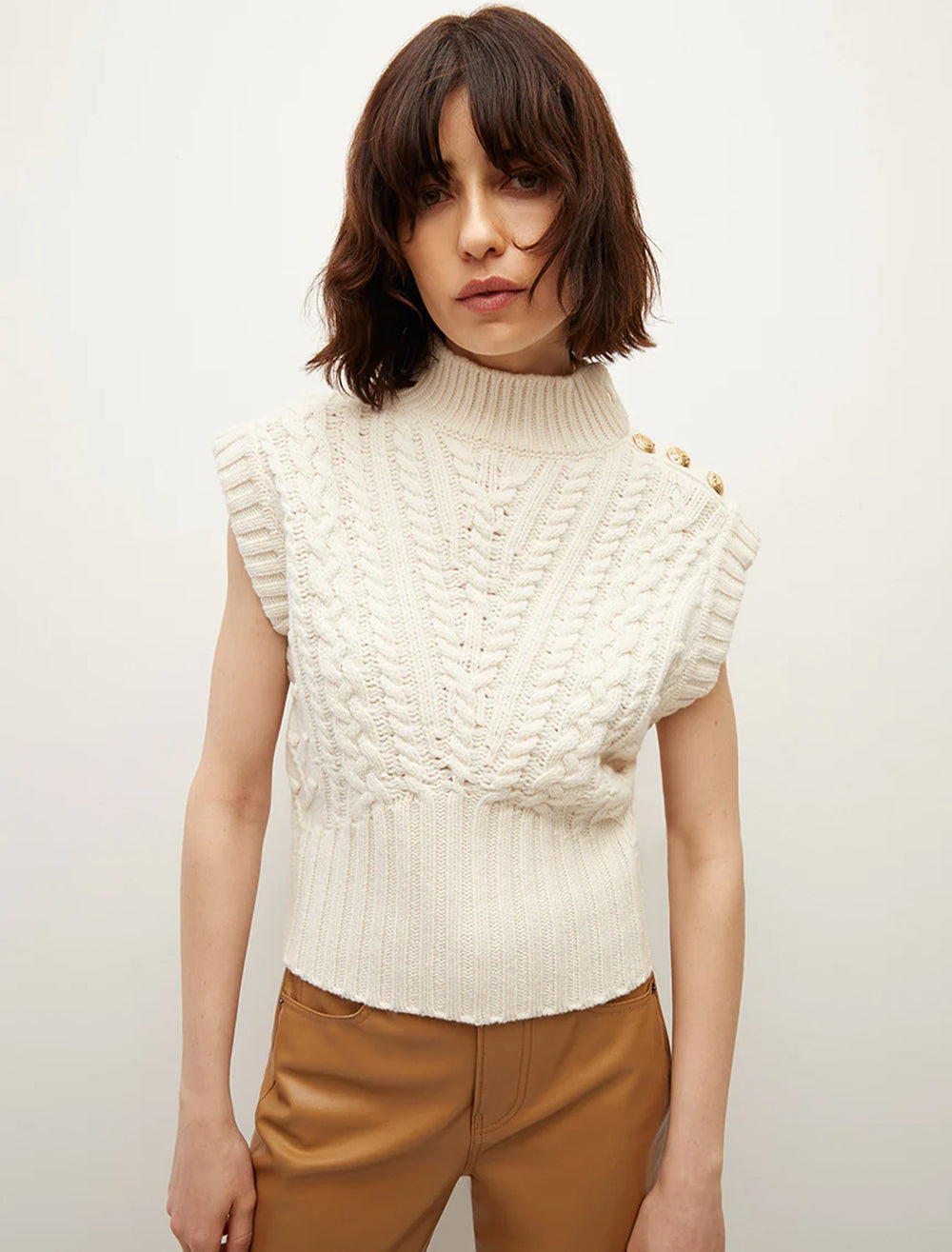 Model wearing Veronica Beard's holton knit vest in off white.