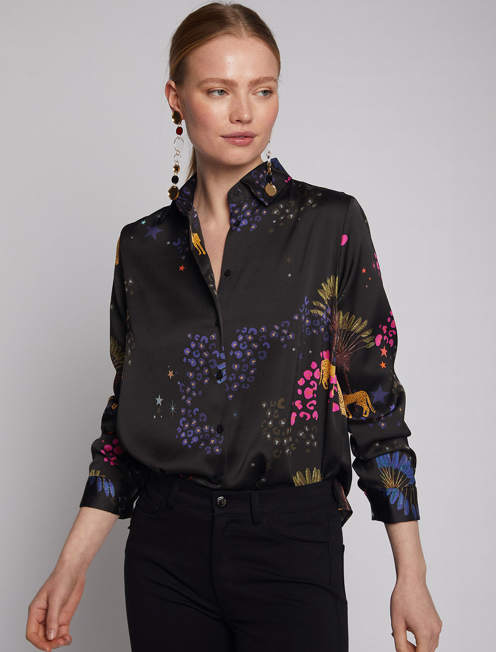Model wearing Vilagallo's camisa isabella black cheetah blouse.