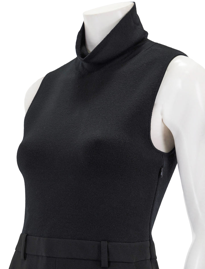 Close-up view of Theory's funnel neck dress in black.
