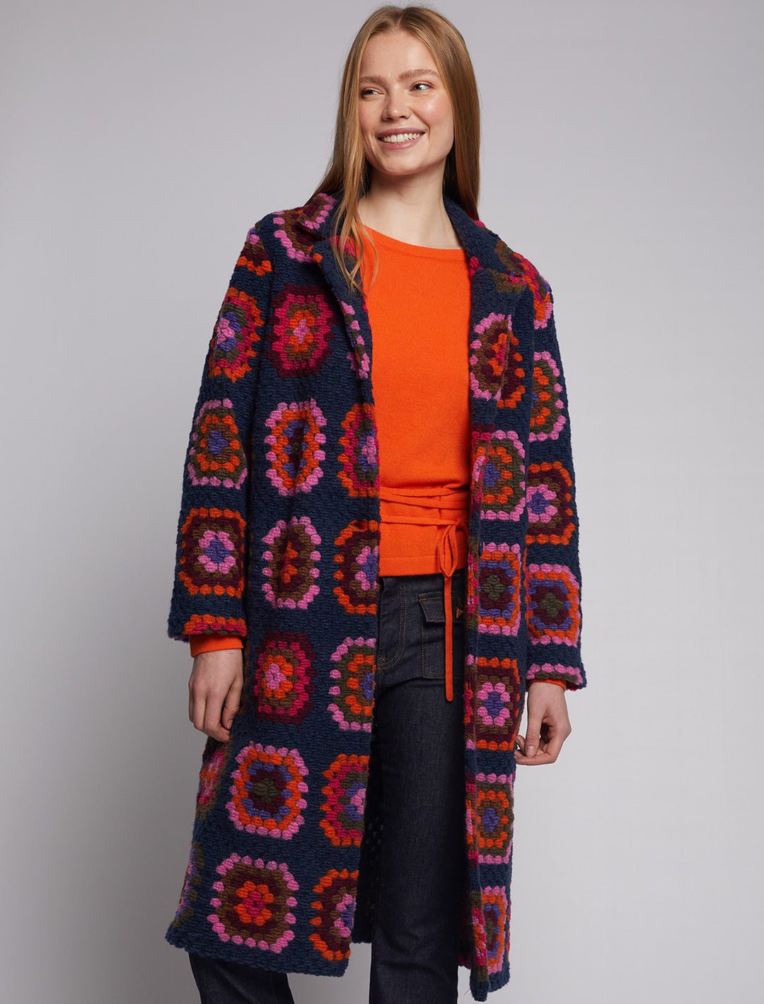 Model wearing Vilagallo's yana crochet cardigan coat.