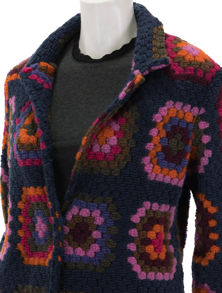 Close-up view of Vilagallo's yana crochet cardigan coat.