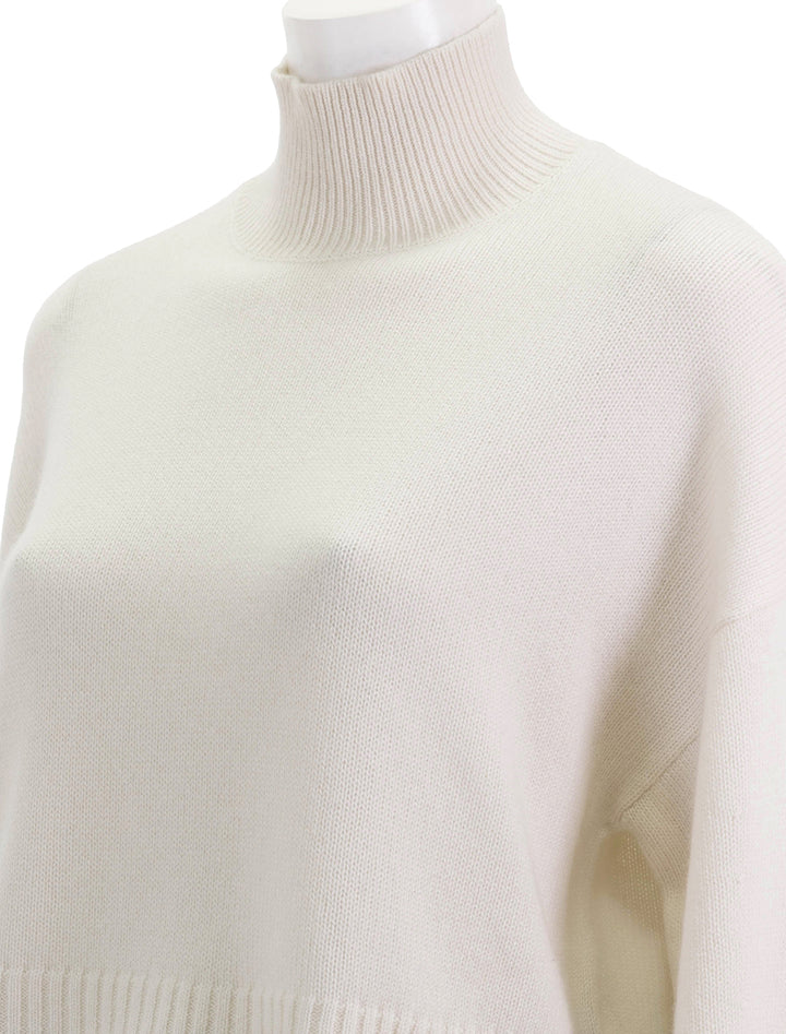 Close-up view of Theory's cropped tneck cashmere sweater.