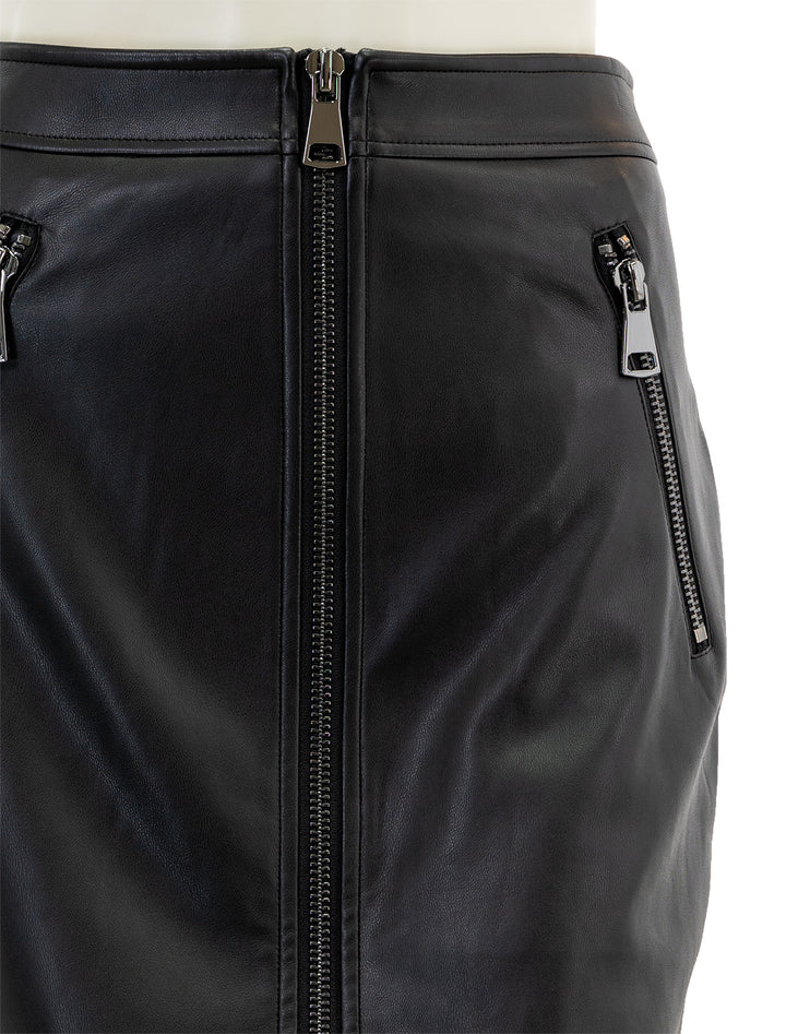 Close-up view of Essentiel Antwerp's encourage faux leather skirt in black.
