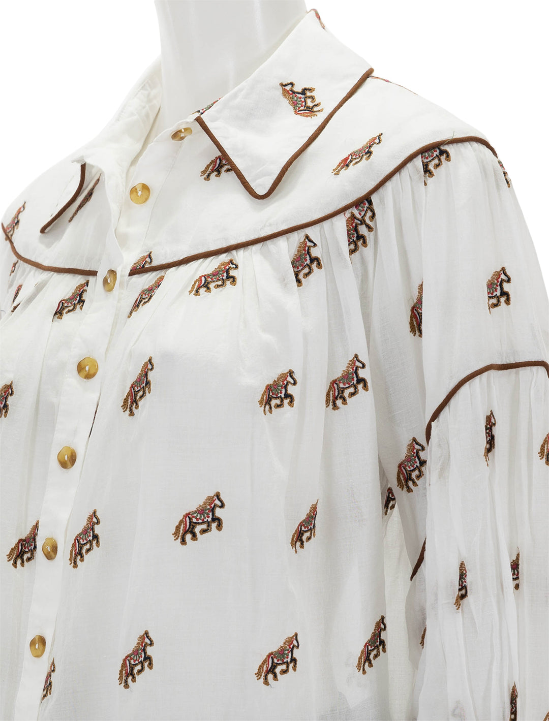 close up view of embroidered horses blouse