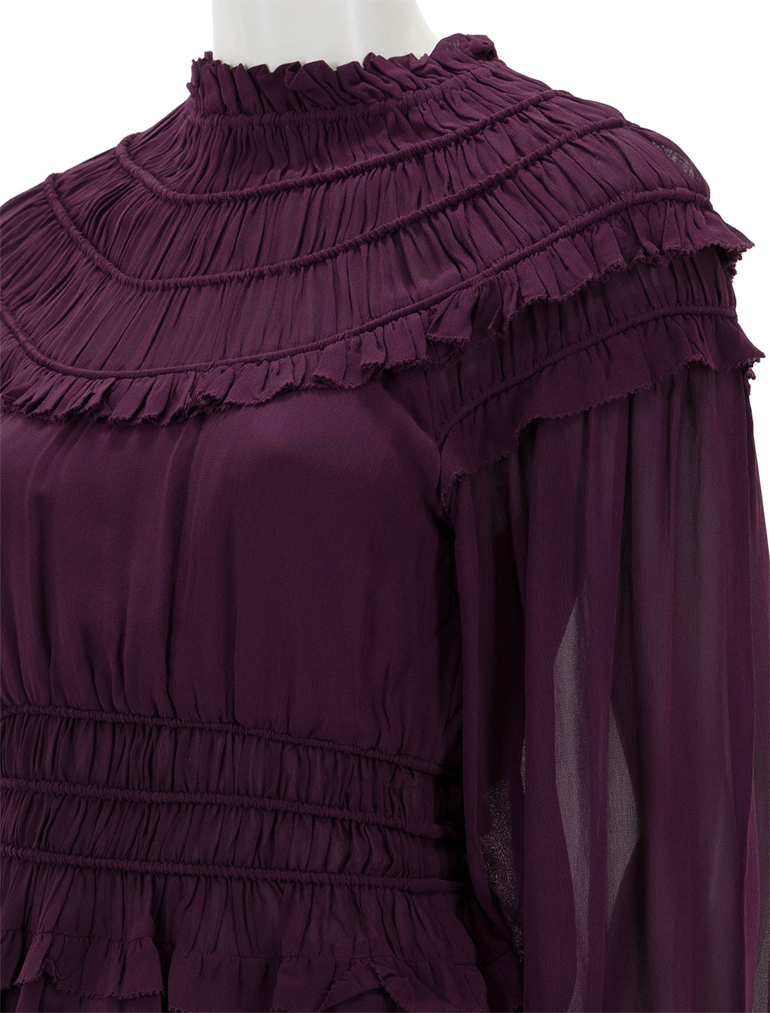 Close-up view of Farm Rio's burgundy ruffled blouse.