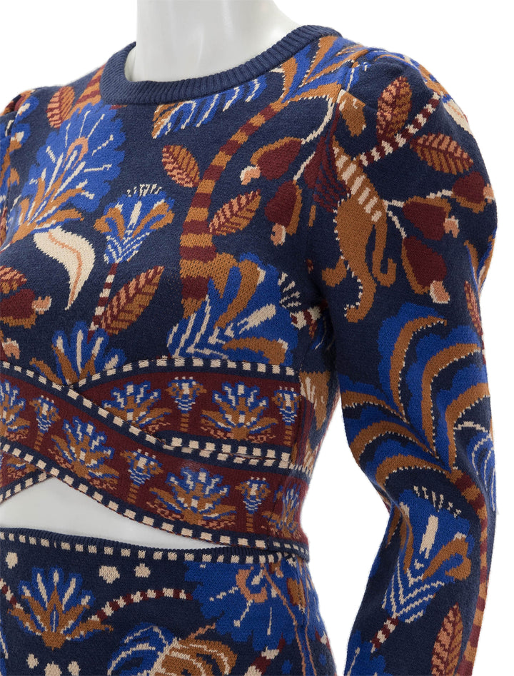 Close-up view of Farm Rio's nature beauty blue scarf knit long sleeve crop top.