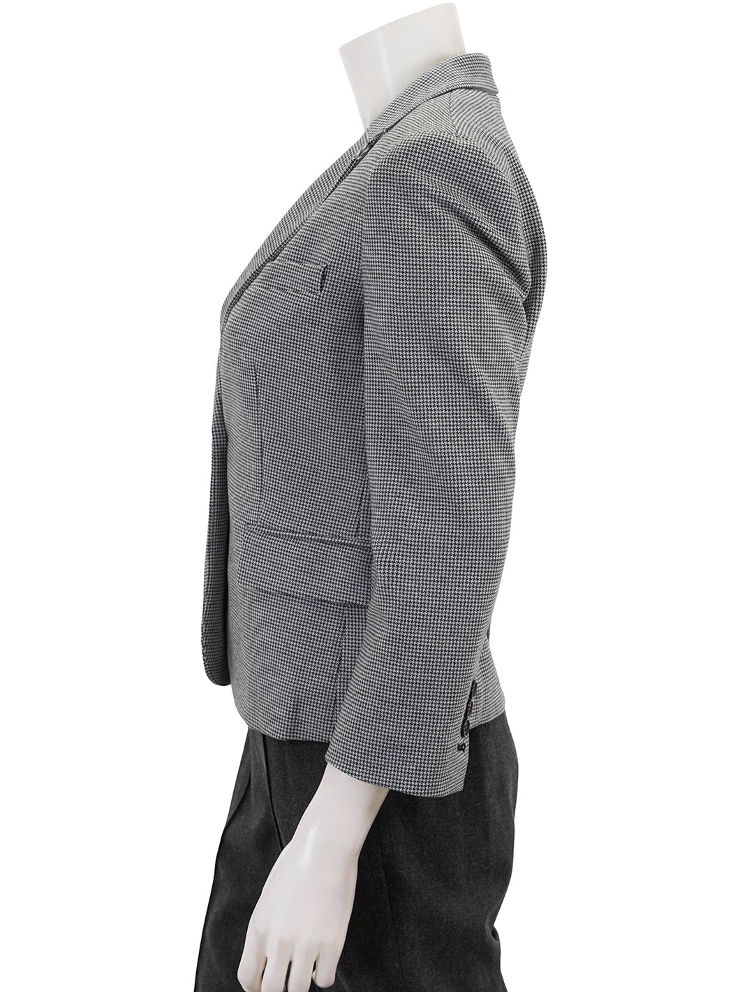 Side view of Theory's shrunken knit blazer in black & white multi.