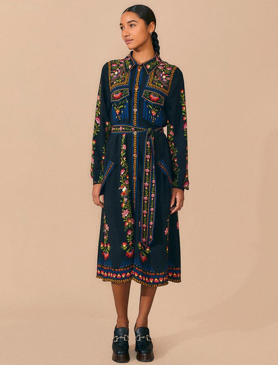 Model wearing FARM Rio's toucan garden black midi dress.