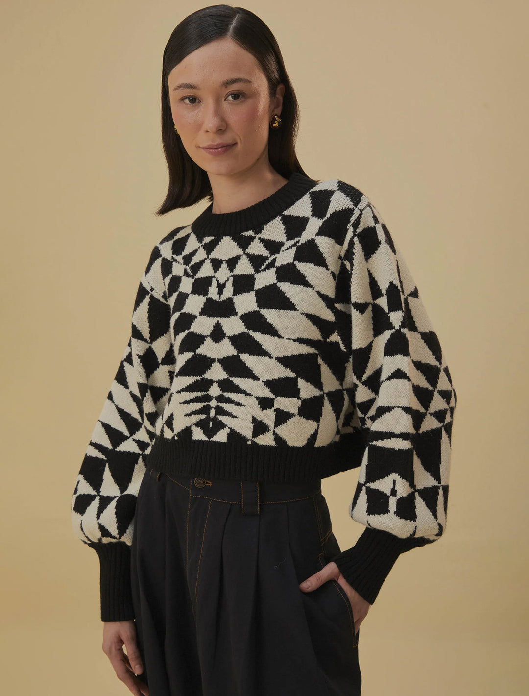 Model wearing FARM Rio's heart deco black knit sweater.