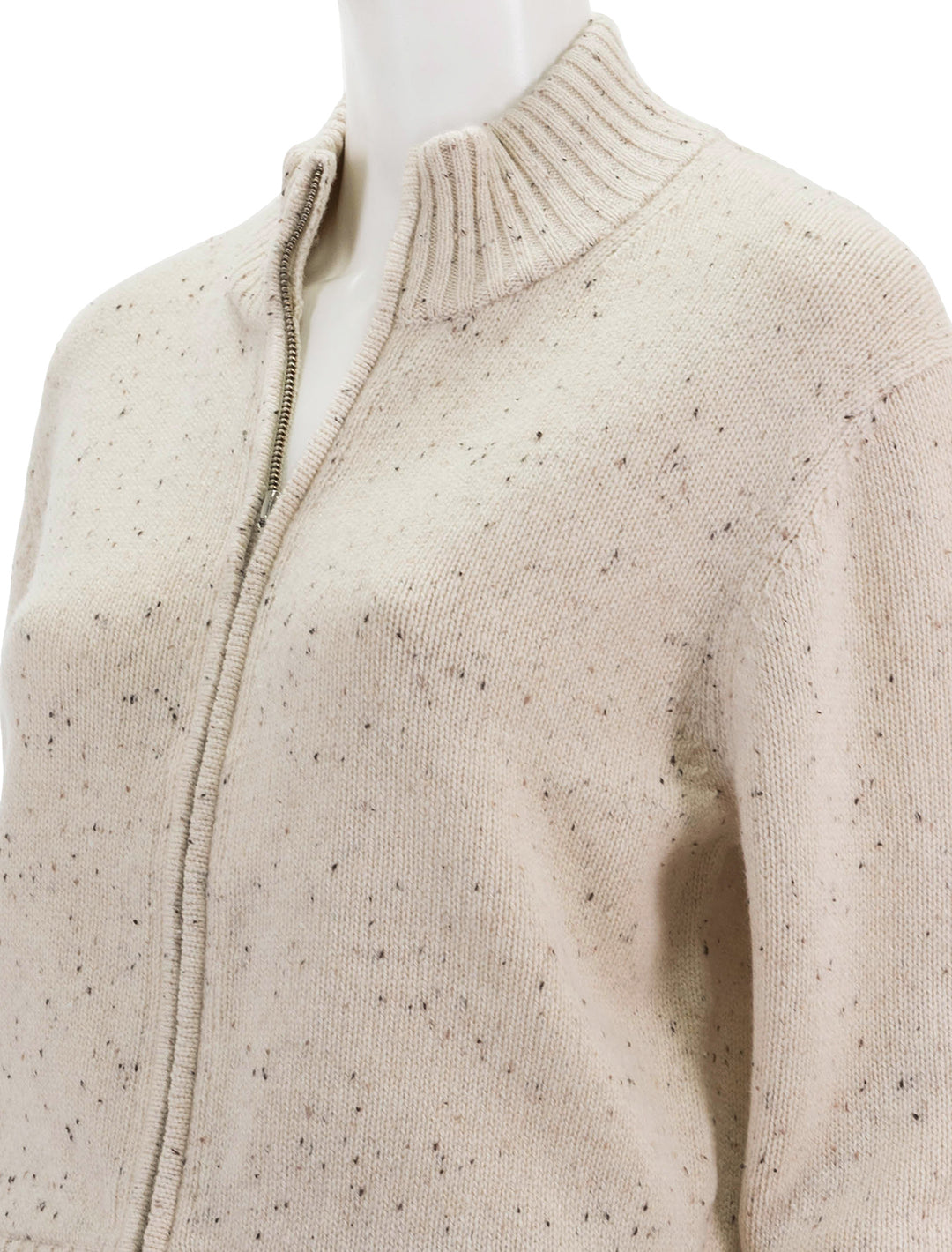 Close-up view of Theory's mock zip cardigan in cream.