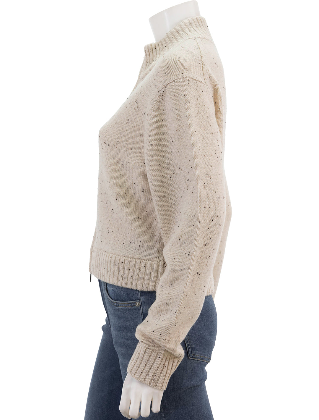 Side view of Theory's mock zip cardigan in cream.