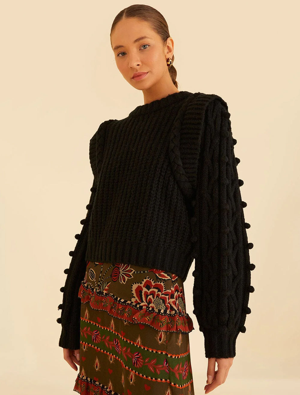 Model wearing FARM Rio's black braided sweater.