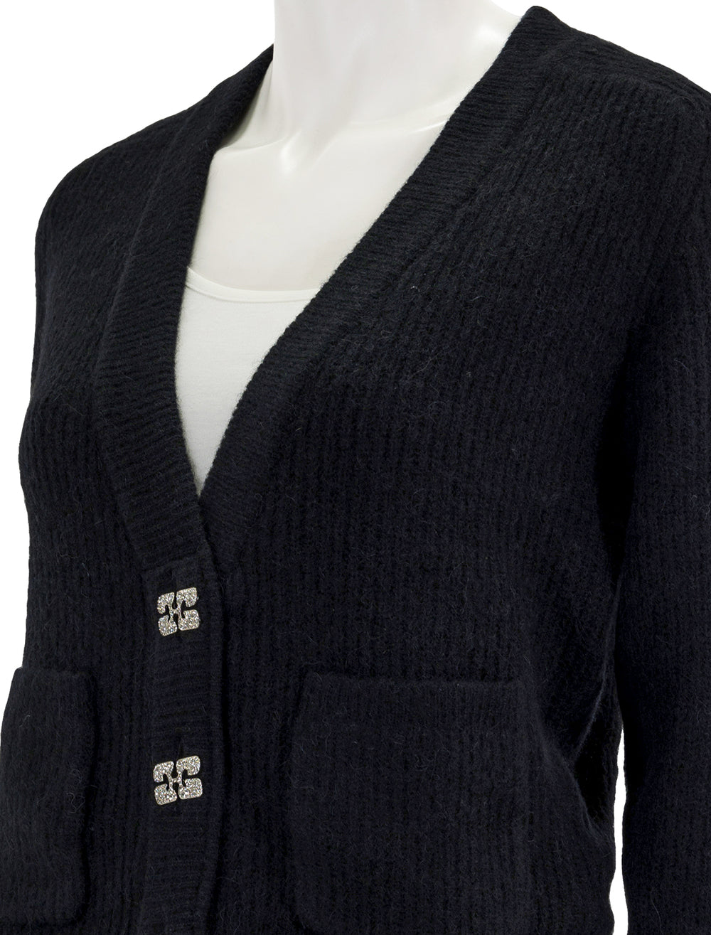 Close-up view of GANNI's soft wool cardigan in black.
