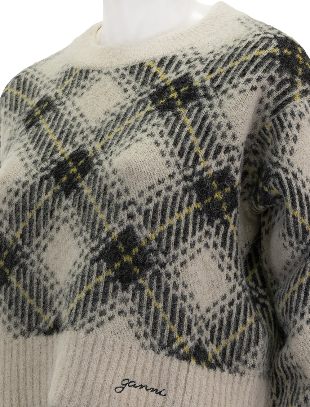 Close-up view of GANNI's check wool oversized pullover in egret.