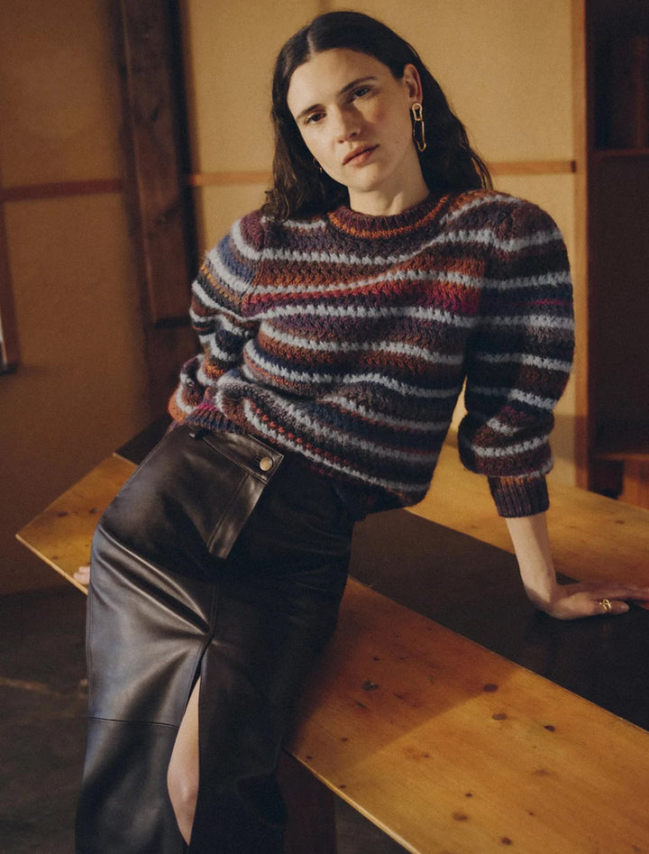 Model wearing Sessun's kaly sweater in plum stripe.