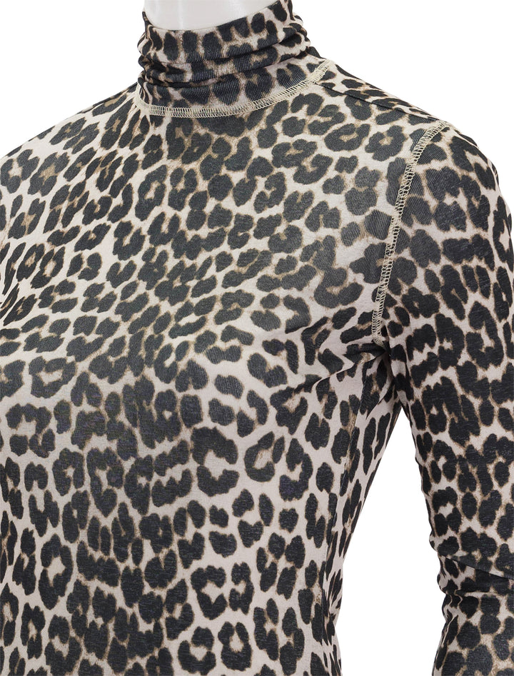 Close-up view of Suncoo Paris' manech turtleneck in beige cheetah.