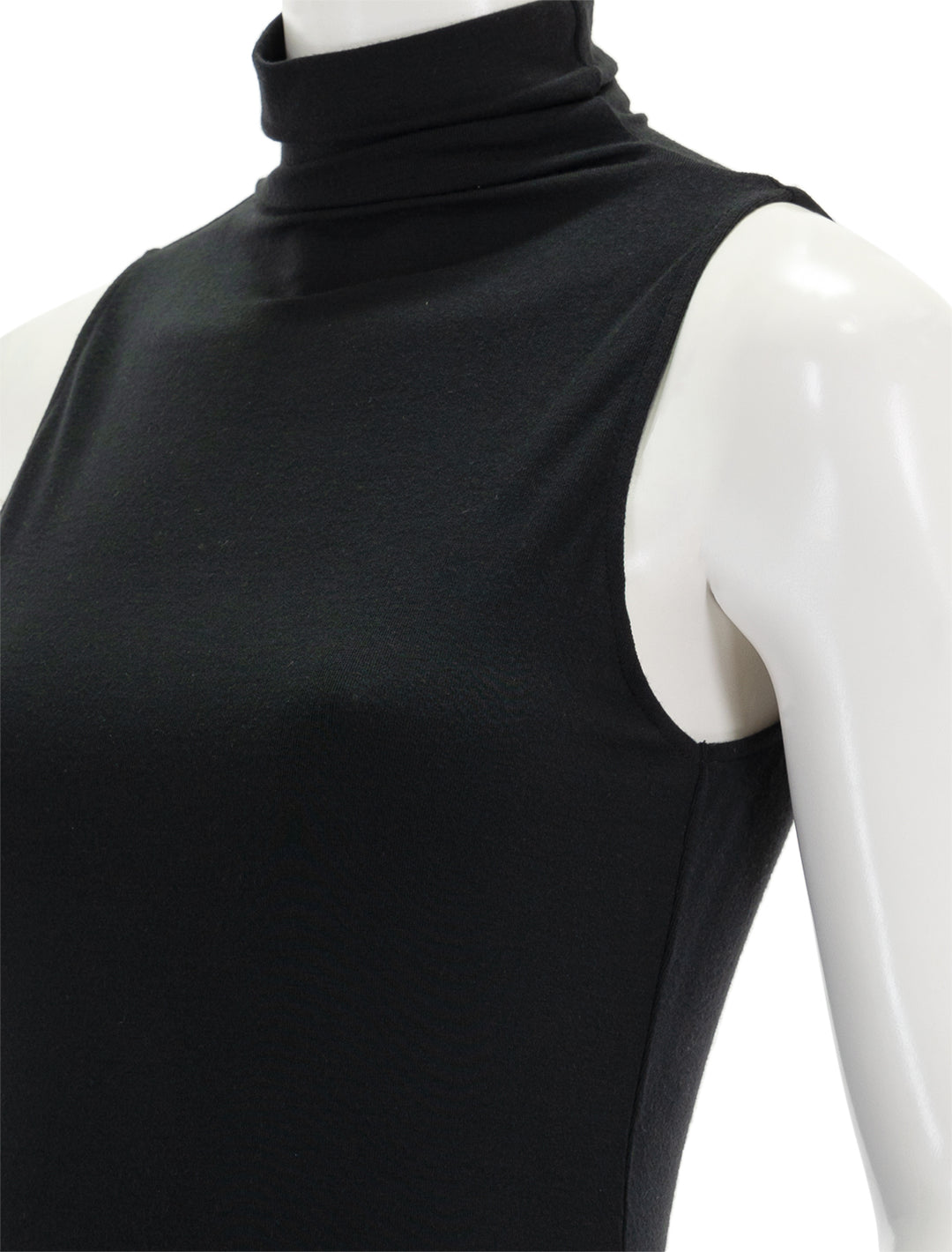 Close-up view of Vince's black sleeveless turtleneck.