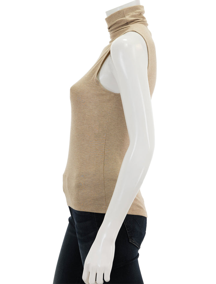 Side view of Vince's sleeveless turtleneck in cashew.