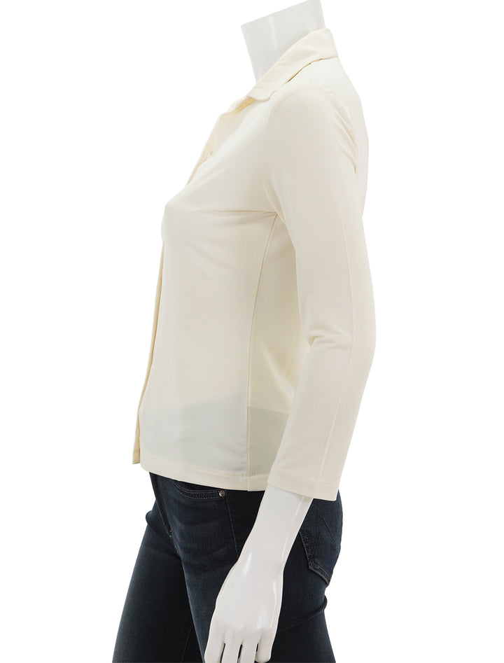 Side view of Vince's 3/4 sleeve button up shirt in sun stone.