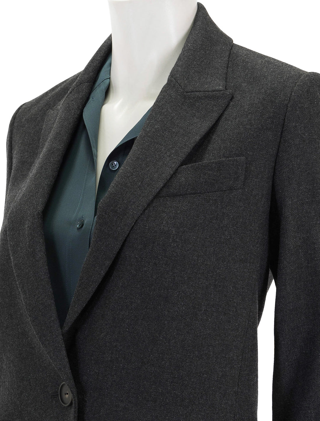 Close-up view of Vince's charcoal single breasted blazer.