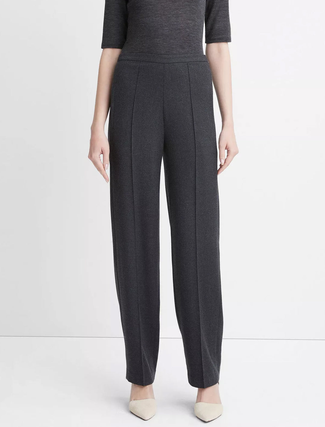 Model wearing Vince's charcoal mid rise wide leg pant.