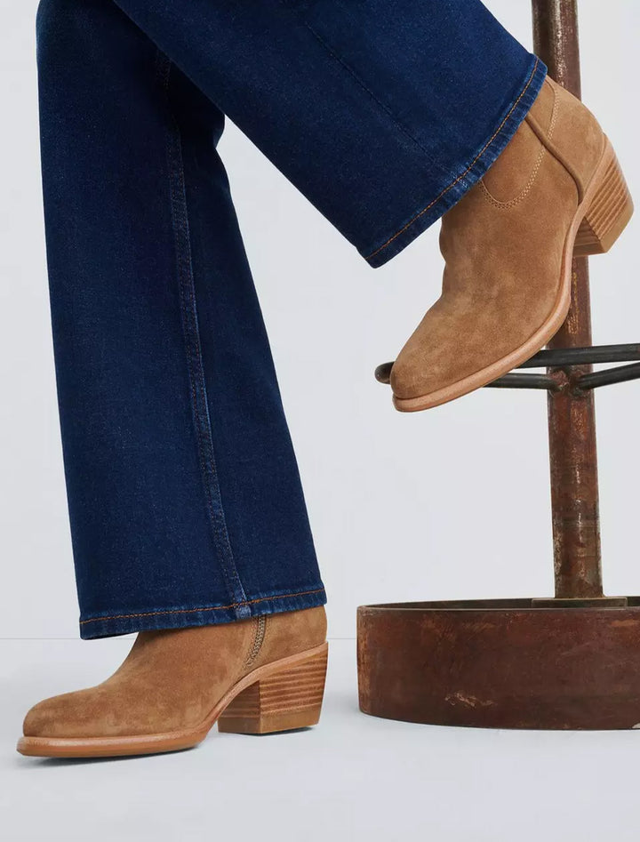 Model wearing Rag & Bone's mustang boot in camel suede.