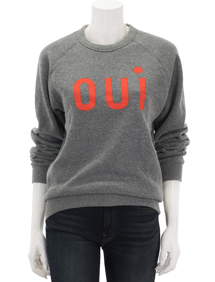 Front view of Clare V.'s oui sweatshirt in heather grey and poppy.