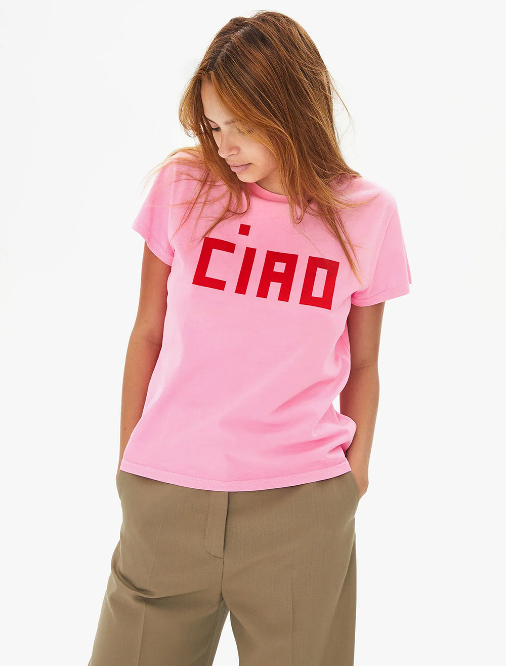 Model wearing Clare V.'s ciao tee in neon pink and poppy.
