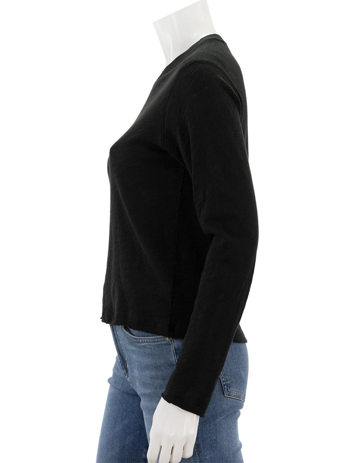 Side view of ATM's slub jersey long sleeve destroyed crop tee in black.