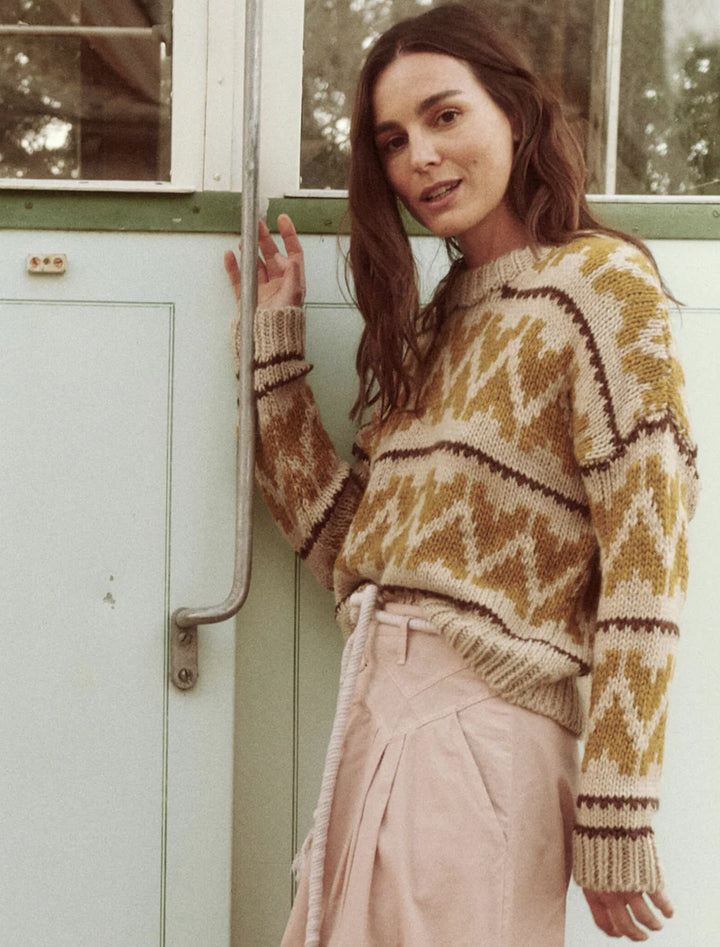 Model wearing The Great's the folk pullover in earth tone.