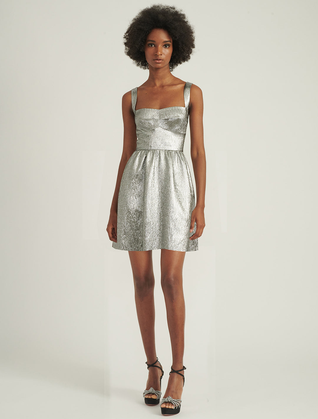 Model wearing Saloni's rachel mini dress in silver.