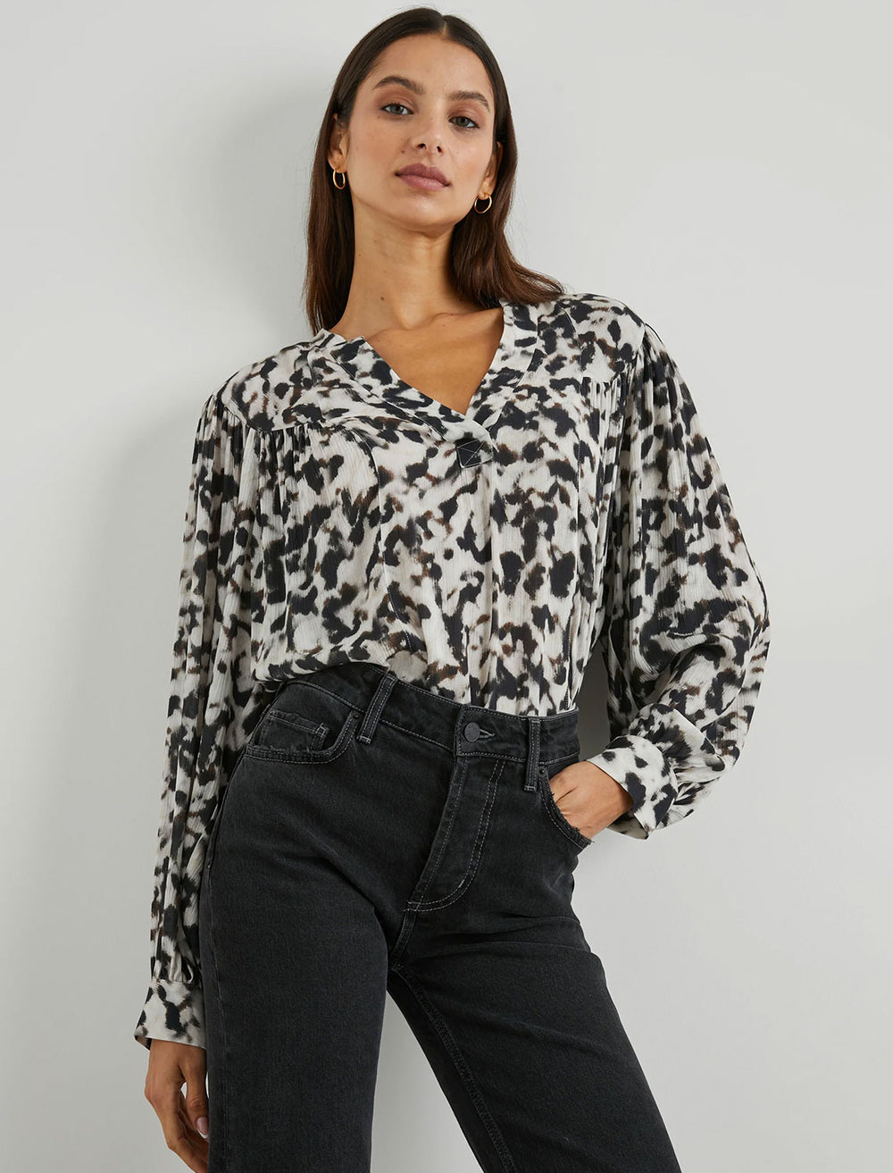 Model wearing Rails' fable blouse in blurred cheetah.