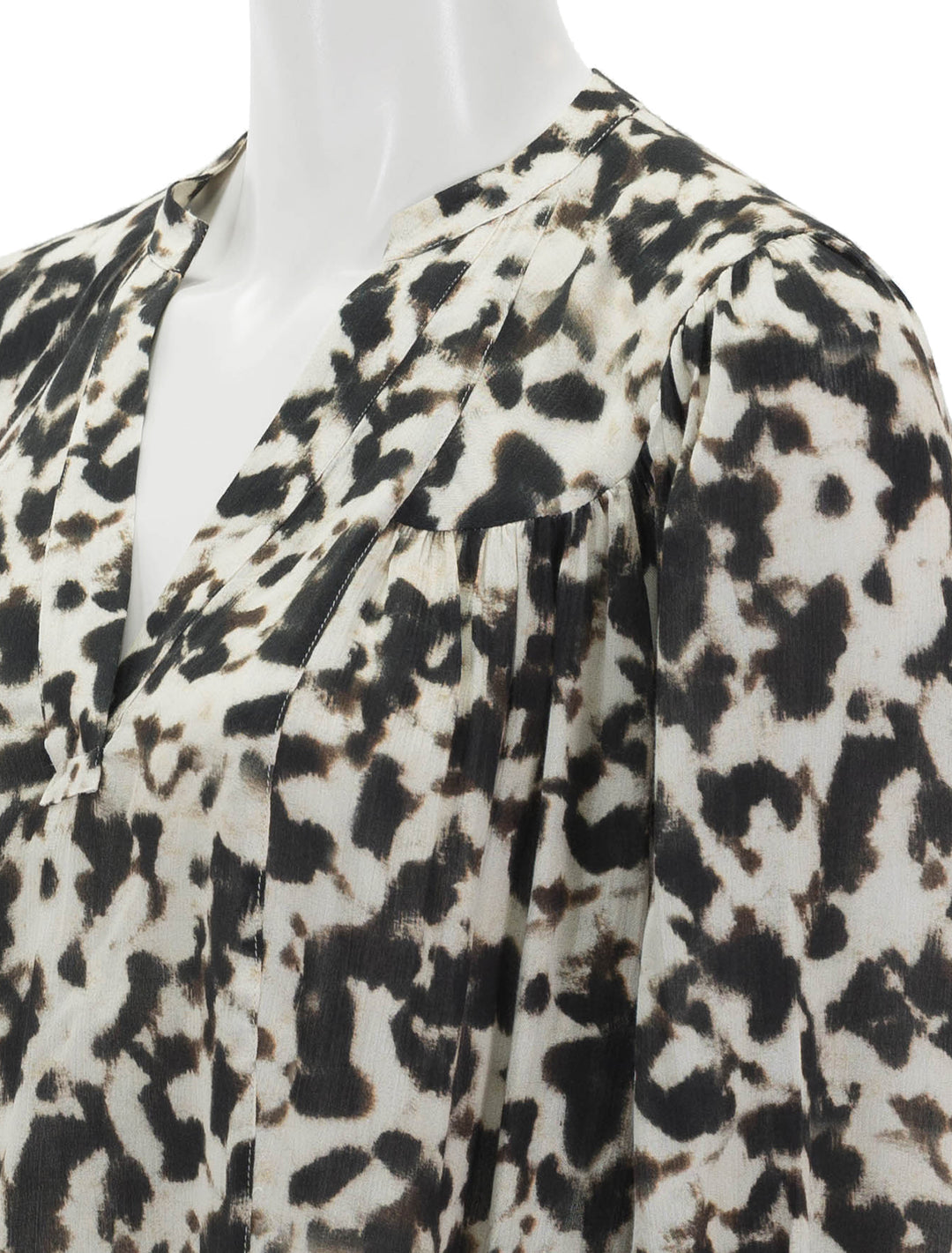 Close-up view of Rails' fable blouse in blurred cheetah.