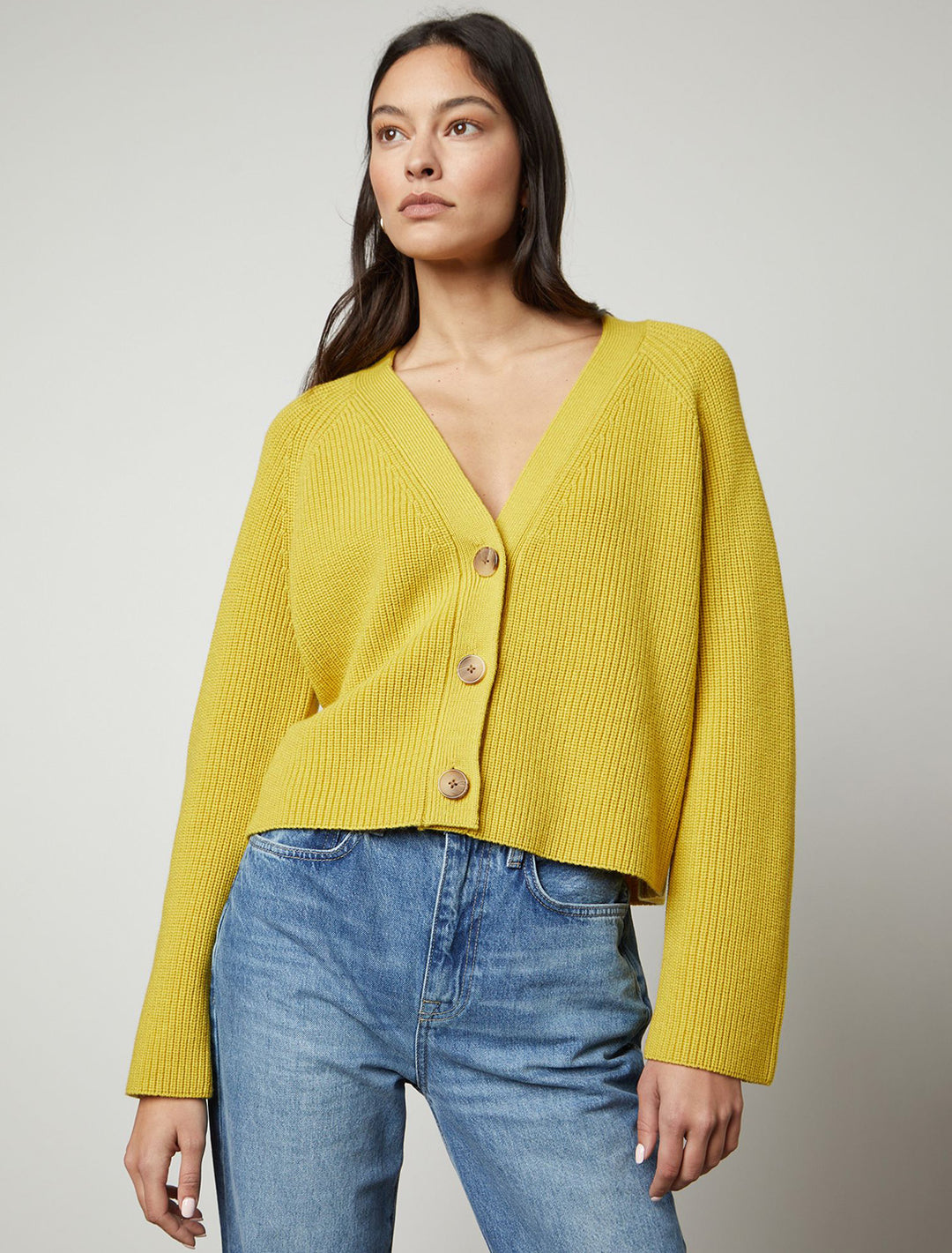 Model wearing Velvet's Marilyn Cardigan in Sunflower.