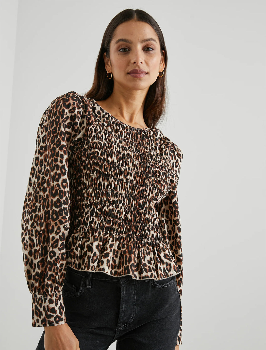 model wearing tabi top in cheetah with black jeans