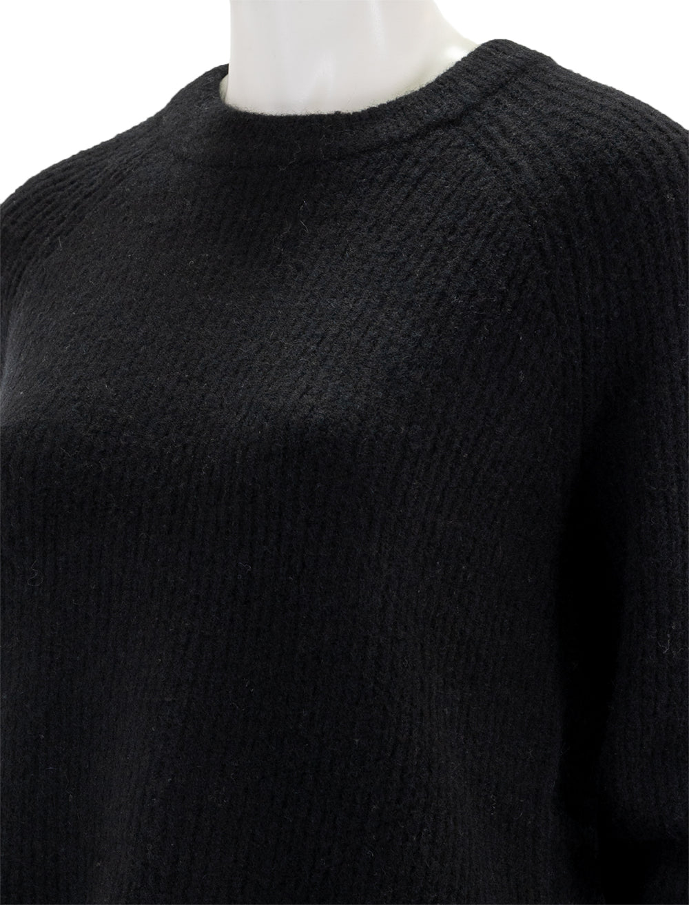 Close-up view of Velvet's gigi pullover in black.
