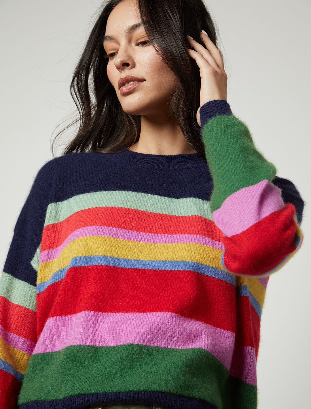Model wearing Velvet's kacey cashmere sweater in navy multi stripe.